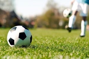 Football ball in a grass
