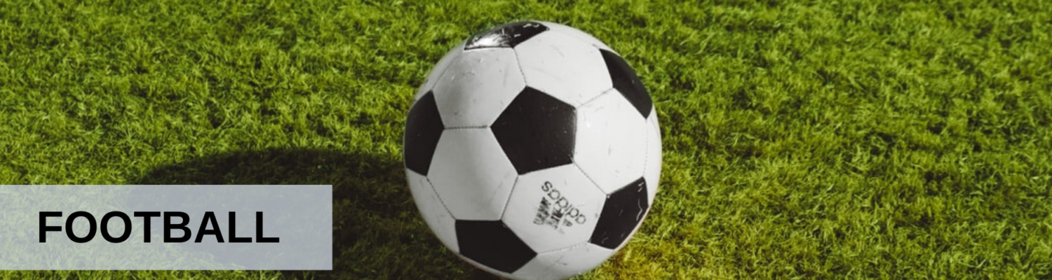 Football ball on grass